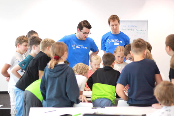 Tomáš mentoring kids in non-profit organization Czechitas  